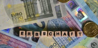 the german word for inheritance with wooden cubes and euro bills